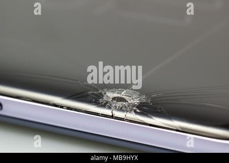 New and modern smartphone with screen has cracks, Touch screen smartphone with broken screen isolated on white background, with clipping path. Stock Photo