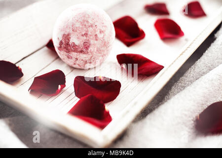 Bomb salt bath decorated with dried roses on a white background Stock Photo
