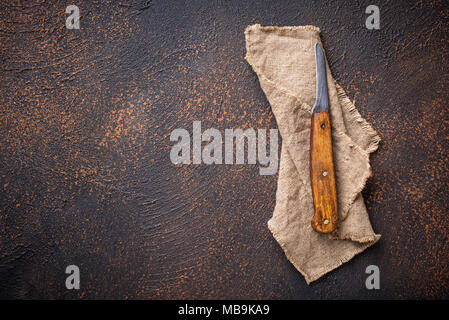 Old vintage knife on rusty background Stock Photo