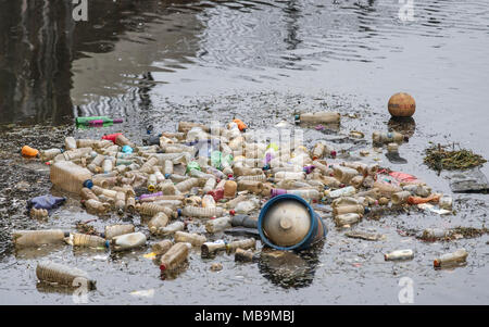 Waste single use plastic bottles seen floating in the water at Cardiff Bay, Wales, UK. Stock Photo