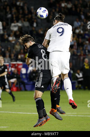 April 8, 2018 - Los Angeles, California, U.S - Los Angeles GalaxyÃ•s forward Zlatan Ibrahimovic (9) of Sweden, and Sporting Kansas CityÃ•s defender Graham Zusi (8) battle for a head ball during the 2018 Major League Soccer (MLS) match between Los Angeles Galaxy and Sporting Kansas City in Carson, California, April 8, 2018. Sporting Kansas City won 2-0. (Credit Image: © Ringo Chiu via ZUMA Wire) Stock Photo