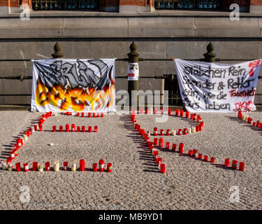 Germany Berlin, Mitte, 8th April 2018. Berlin Firefighters oppose austerity policies of state government in ‘Berlin Burns’ demonstration in Front of the Red Town Hall Firefighters are protesting about poor working conditions, lack of staff, old equipment and a recently introduced 12-hour shift system. A brazier carries their motto ’Berlin burns’ in a symbolic attempt to alert the public to the dangerous situation. The firefighters’ protest is directed against the Social Democratic-Left Party-Green Party coalition that runs the Berlin state government. credit: Eden Breitz/Alamy Live News Stock Photo