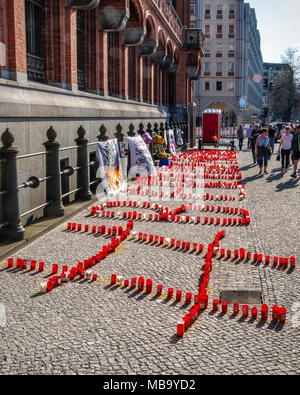 Germany Berlin, Mitte, 8th April 2018. Berlin Firefighters oppose austerity policies of state government in ‘Berlin Burns’ demonstration in Front of the Red Town Hall Firefighters are protesting about poor working conditions, lack of staff, old equipment and a recently introduced 12-hour shift system. A brazier carries their motto ’Berlin burns’ in a symbolic attempt to alert the public to the dangerous situation. The firefighters’ protest is directed against the Social Democratic-Left Party-Green Party coalition that runs the Berlin state government. credit: Eden Breitz/Alamy Live News Stock Photo