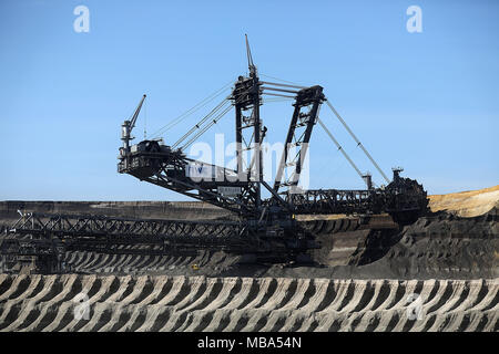 06 April 2018, Germany, Grevenbroich: A bucket wheel excavator mines brown coal at the surface mining Garzweiler in the Rhenish lignite mining region. Photo: Oliver Berg/dpa Stock Photo