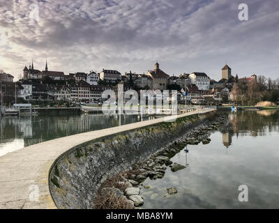 gorgeous view of pier and lake and the picturesque Swiss city of Murten Stock Photo