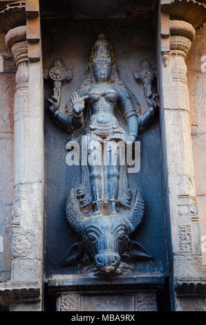 Carved stone idol of Mahishasur Mardini on the outer wall of the Brihadisvara Temple, Thanjavur, Tamil Nadu, India. Stock Photo