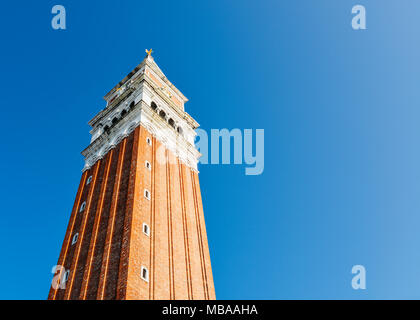Campanile tower under the blue sky in Piazza San Marco, St Mark's Square, Venice, Italy. Stock Photo