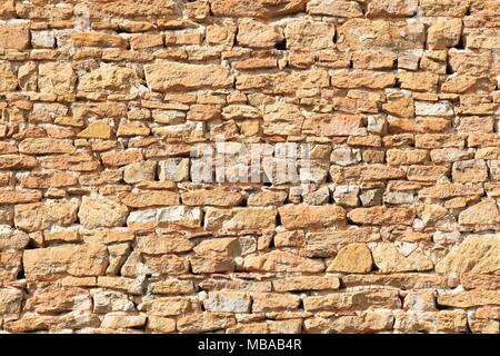 Background of orange stone wall texture in Beaujolais, France Stock Photo