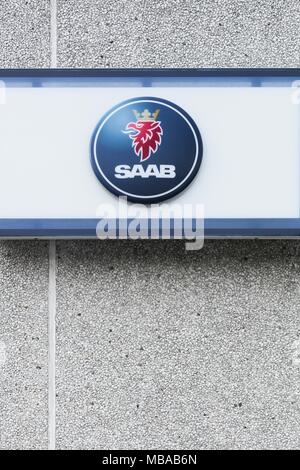 Risskov, Denmark - September 10, 2015: Saab logo on a wall. Saab was a manufacturer of automobiles that was founded in Sweden in 1945 Stock Photo