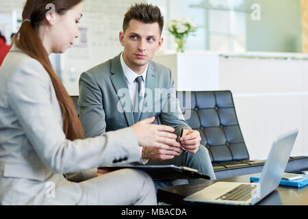 Young Colleagues Discussing Business Project Stock Photo