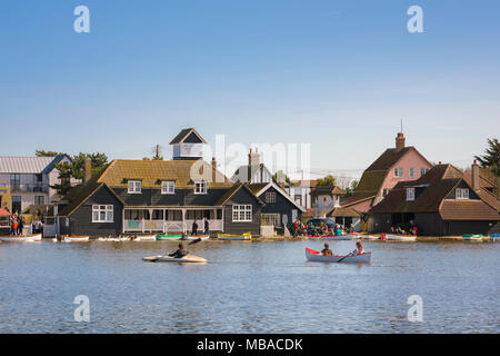 Thorpeness Suffolk lake, people enjoy a sunny afternoon boating on the lake in the centre of Thorpeness known as The Meare, Suffolk, England, UK. Stock Photo