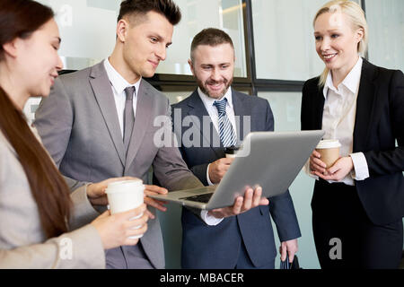 Business Team Using Laptop Stock Photo