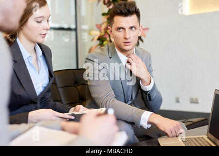 Team of Business Professionals Collaborating on Startup Stock Photo