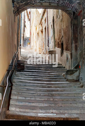 ancient staircase with an arch in the center of Cortona in Tuscany, Italy Stock Photo