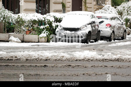 cars parked in the city almost completely covered with snow. winter and cold temperature concept Stock Photo