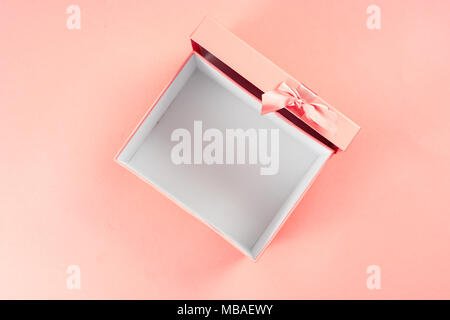 Top view of opened gift box on pink background Stock Photo
