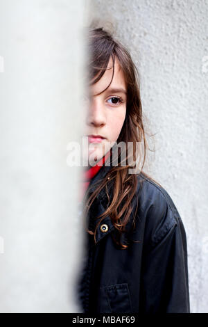9 year old boy waiting in doorway. Stock Photo