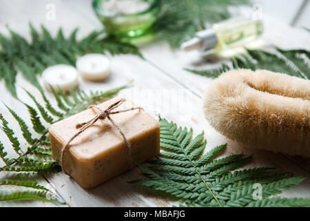 tools and accessories for spa treatments and relaxation.Washcloth, sea salt, lotion, candles Stock Photo
