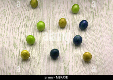 Stylish Frame background with quail, gold and blue easter eggs with copy space for text. isolated on white background. Flat lay, top view. Easter conc Stock Photo