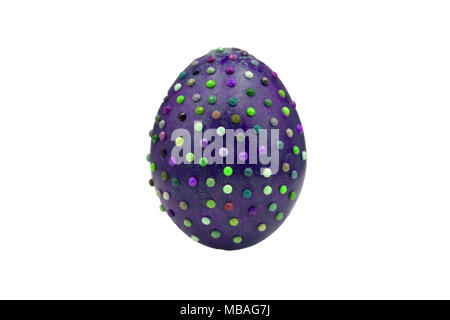 One marble textured stone epensive violet and fashionable easter egg on a gold stand for easter holidays. Perfect for a designer eastern table or setu Stock Photo