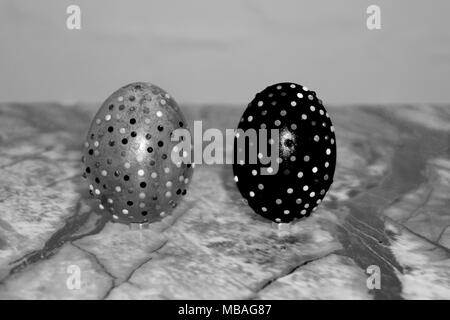 Modern painted easter eggs on wooden table. Toned picture Stock Photo