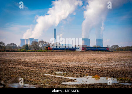 Fiddlers Ferry power station steaming cooling towers. East Midlands train.