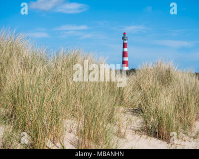 View on lighthouse in the dunes of Ameland, Holland Stock Photo