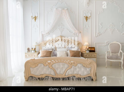 Luxury retro white bedroom in the morning Stock Photo