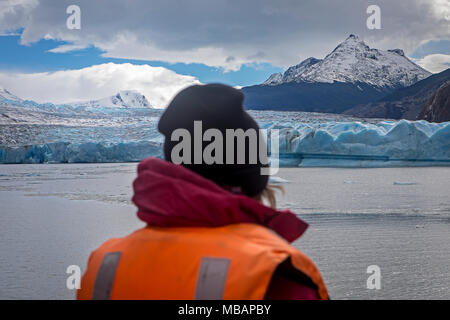 Grey Glacier and Hiker in a Catamaran, crossing Grey lake between Refugio Grey and Hotel Lago Grey, Torres del Paine national park, Patagonia, Chile Stock Photo