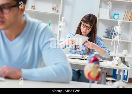 Two medical students studying in classroom Stock Photo