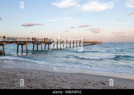 Beautiful view of Anglin's fishing pier, in Florida at sunset. People gather to watch and fish. Stock Photo