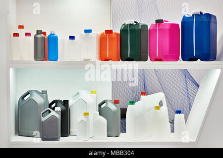 Empty colorful plastic cans for liquids in the store Stock Photo