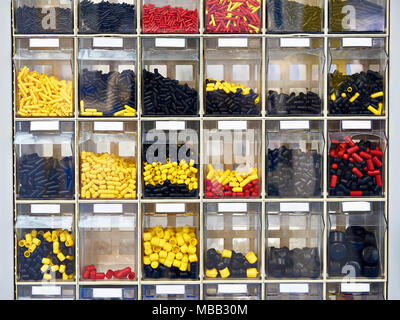 Products from plastic for furniture in transparent boxes Stock Photo