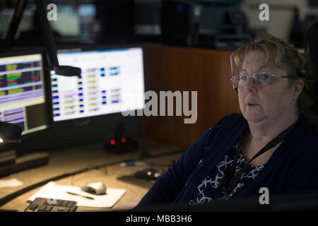 Loudon, USA. 9th April, 2018. Dispatcher Gail Dry works at the call center at the Loudoun County Emergency Communications Center handling 911 calls. It’s National Public Safety Telecommunicators Week. (Photo by Douglas Graham/Loudoun Now) Credit: William Graham/Alamy Live News Stock Photo