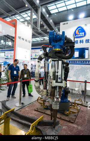 Industrial manufacturing robot exhibit at technology fair in Shenzhen, China. Stock Photo