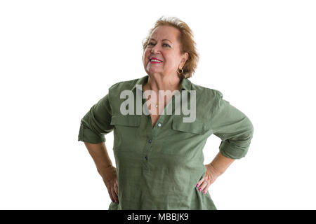 Portrait of smiling self-confident senior woman standing against white background Stock Photo