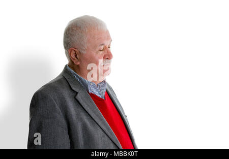 Tired exhausted senior man over a white background standing with his eyes closed and a wan expression with copy space Stock Photo