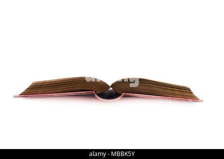 very old book opened in half, on white background Stock Photo