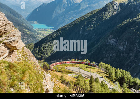 Mountain train at Alp Gruem train station, with the Valposchiavo in the background, Engadin, Switzerland Stock Photo