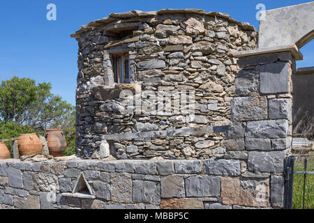 In traditional way rebuild house by archeological place, ruins in Chamezi. Remains after ancient minoan civilization. Aegean Bronze Age. Crete, Greece Stock Photo