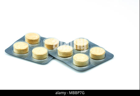 Anthelmintic tablets pills in blister packs on white background with copy space. Set of four tablets pills : niclosamide and phenolphthalein for treat Stock Photo