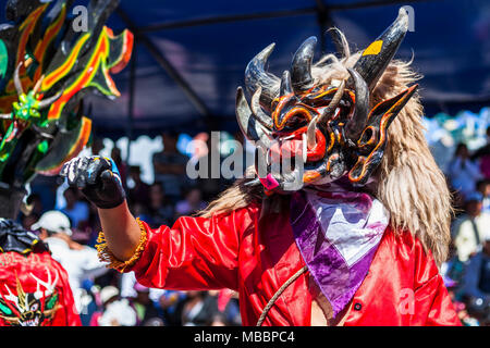 Píllaro, ECUADOR - FEBRUARY 6, 2016: Unknown locals dressed up participating in the Diablada, popular town celebrations with people dressed as devils  Stock Photo
