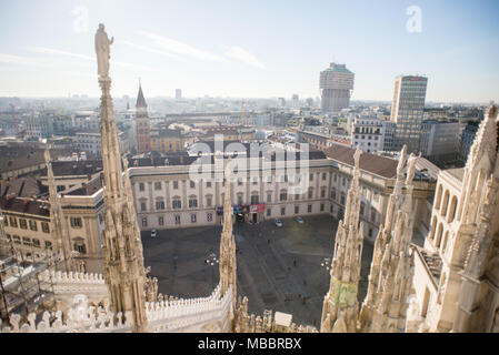 Milan, Italy - October 24, 2017: View from Milan Duomo Cathedral. Royal Palace of Milan - Palazzo Realle and Velasca Tower. Bell Tower in Saint Gottar Stock Photo