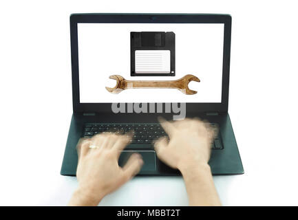 hands typing on laptop pc searching for computer service concept Stock Photo