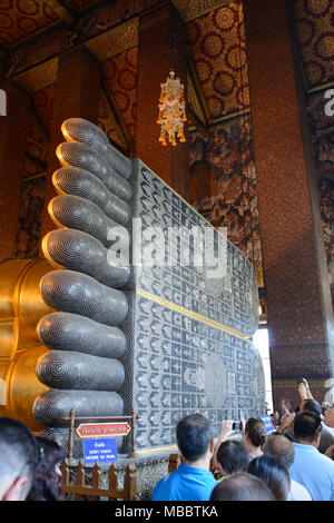 BANGKOK, THAILAND - DECEMBER 29, 2012: Foot of reclining Buddha in Wat Pho. The foot dislpay 108 auspicious symbols of Buddha. Stock Photo