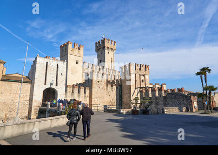 Sirmione, Italy - February 21, 2016: The Scaliger Castle is a medieval port fortification located at the entrance to the sirmio peninsula which divide Stock Photo