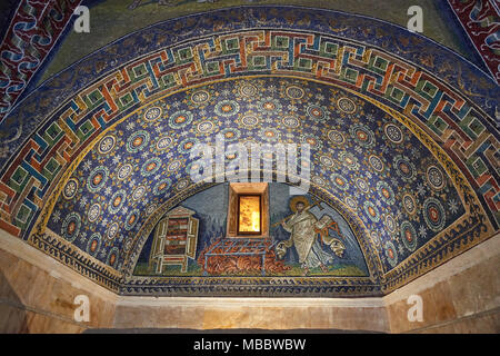 Ravenna, Italy - Febuary 18, 2016: Interior of Mausoleum of Galla Placidia, a Roman chapel embellished with colorful Roman mosaics in Ravenna. It was  Stock Photo