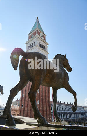 Venice, Italy - Febuary 19, 2016: Horses of Saint Mark, a replica of the Triumphal Quadriga. It is placed on the facade, on the loggia above the porch Stock Photo