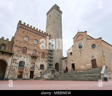 Siena, Italy - Febuary 16, 2016: Duomo di San Gimignano, the Collegiate church of Santa Maria Assunta, is a roman catholic collegiate church and basil Stock Photo