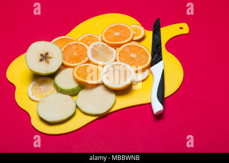 Fruit lying on a cutting board Stock Photo